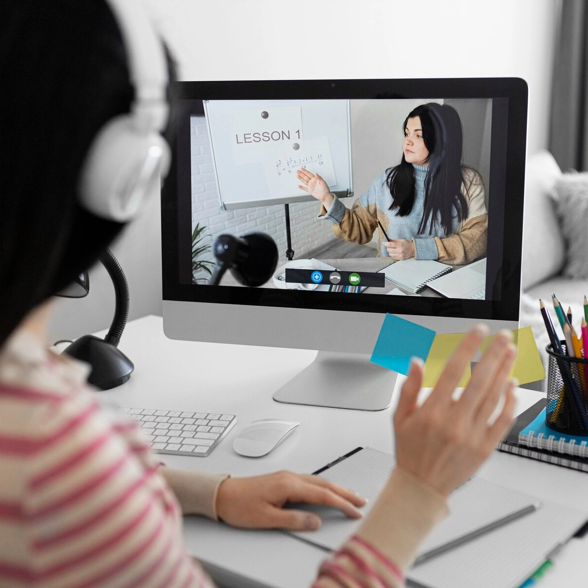 Illustration of an educator signing up for a free trial on a digital device.